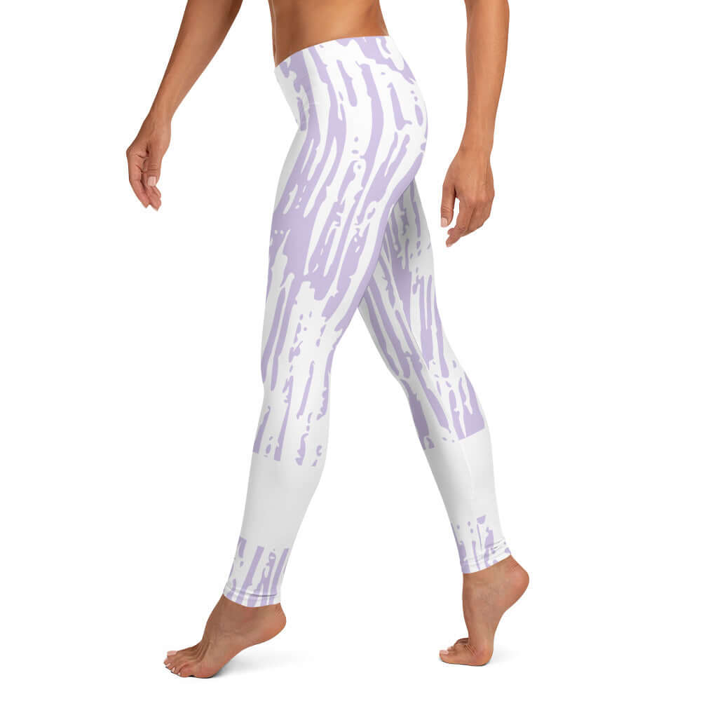 Left leg view of purple and white print leggings with purple text around bottom right leg saying 'Praise Pray 