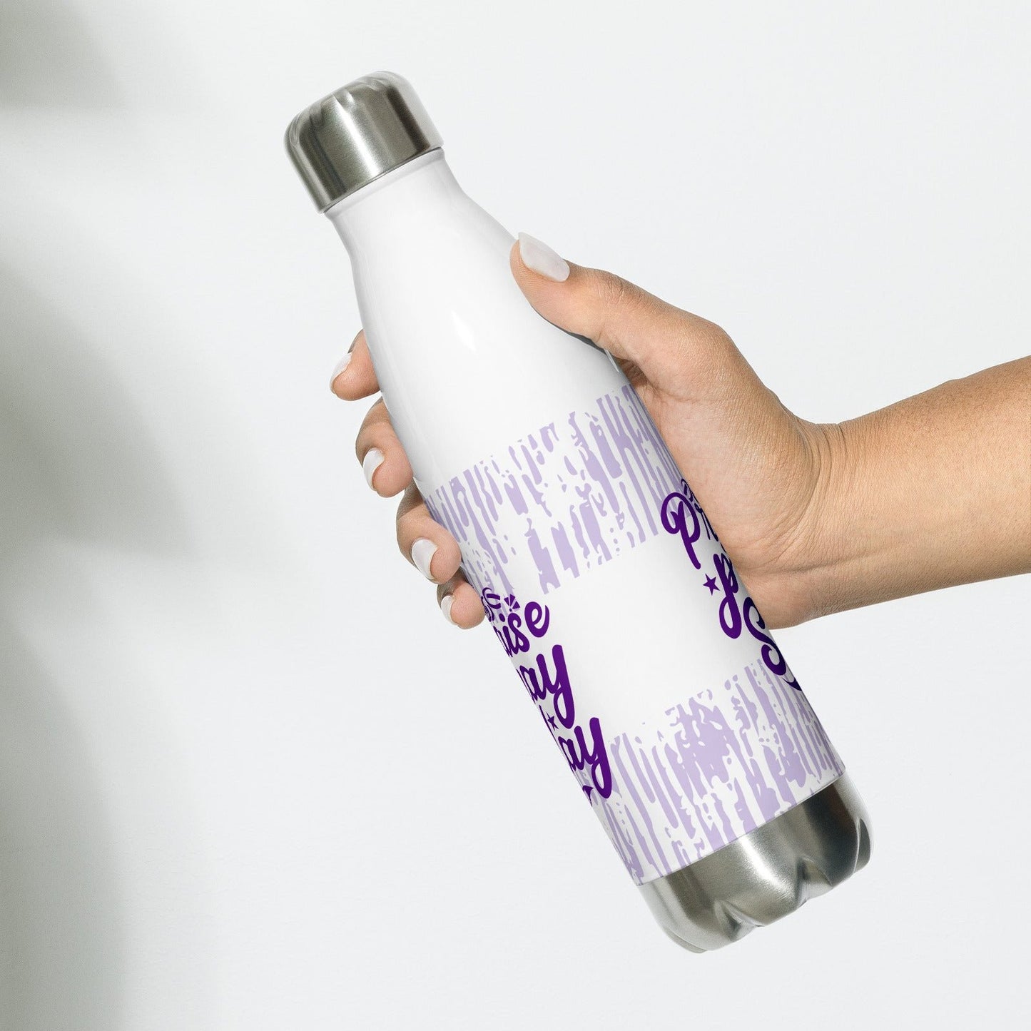 Front of white stainless steel water bottle with purple and white pattern and purple text saying 'praise, pray slay'