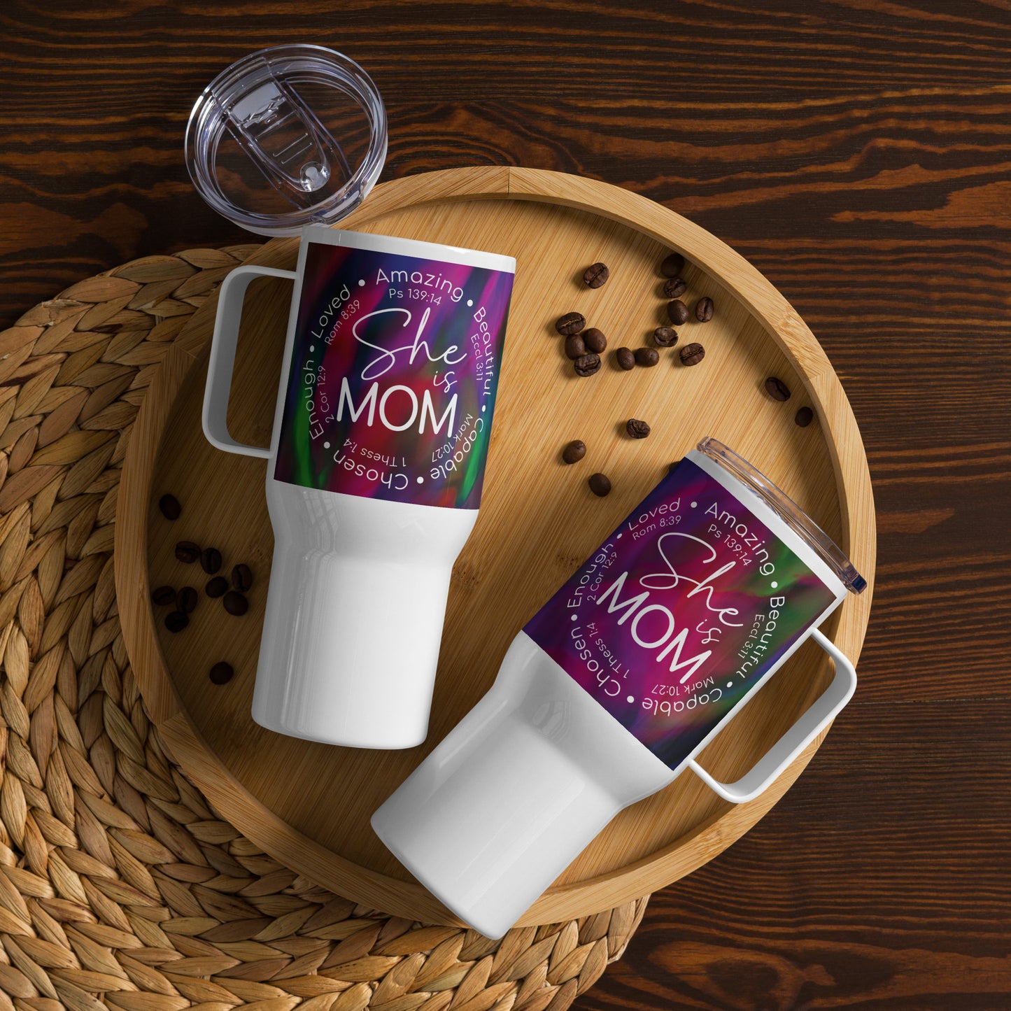 Right and left side views of a white 25 oz travel mug with white text saying 'She is mom' on a purple mazed print background