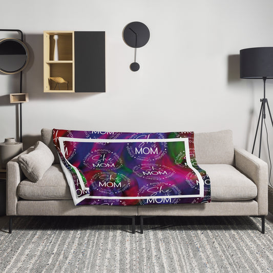 Throw blanket 50x60 with message 'She is Mom" in purple laying on couch