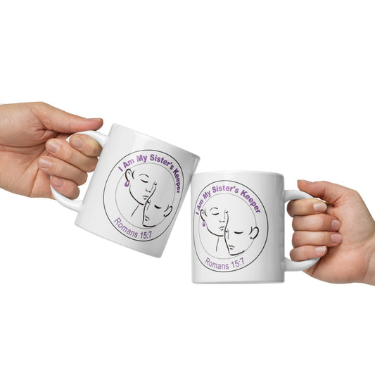 Side views of a white mug with black image of two women depicting sisterhood in inner black circle and purple text saying "I am my sister's keeper, Romans 15:7' on outer black circle