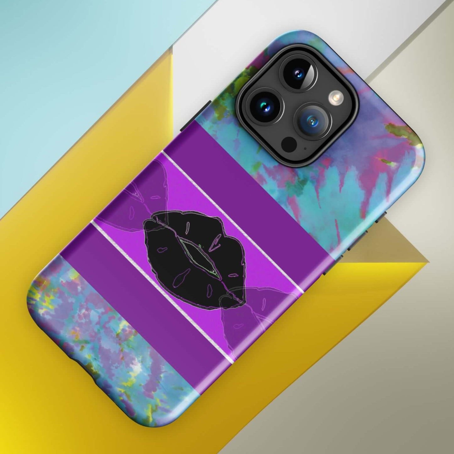 Front of iPhone tough case with blue and purple painted abstract background and middle panel of black lips with a half-purple lip on each side