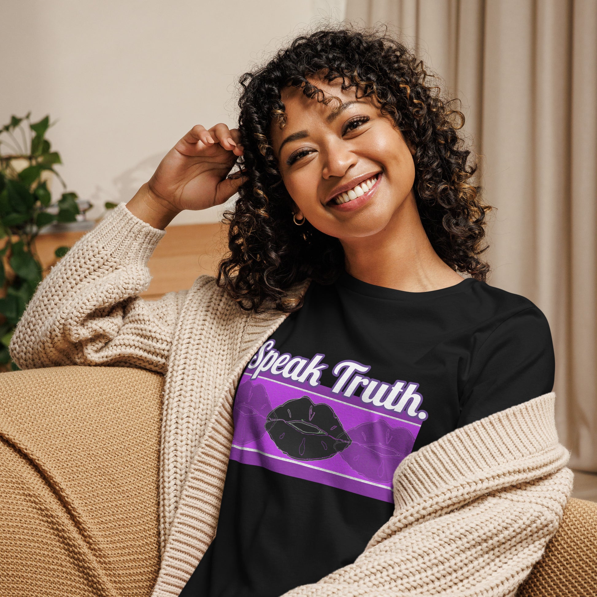 Front of black t-shirt with text saying 'Speak Truth' and black and purple lips design beneath