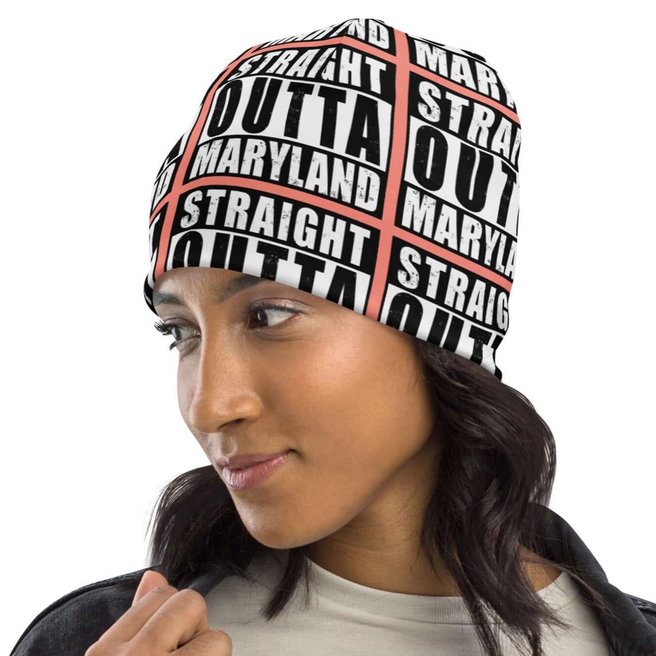 Left front of beanie with rose background and black and white patterned text saying 'Straight Outta Maryland'