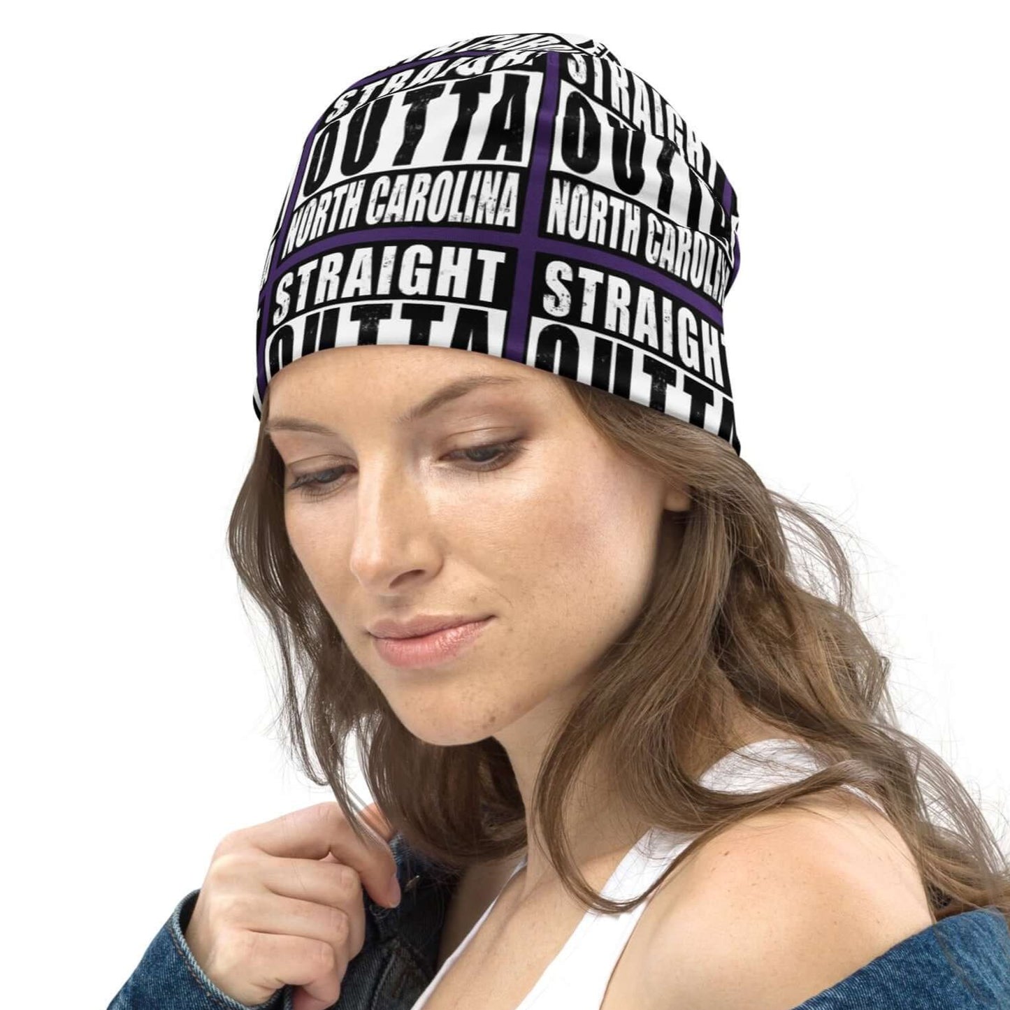 Left view of all-over-print purple black and white beanie with message saying "Straight Outta North Carolina' 