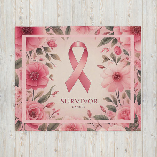Front Survivor floral pink 50 x 60 throw blanket lying flat with image of pink flowers w/green leaves, pink ribbon, and words 'survivor cancer' beneath ribbon