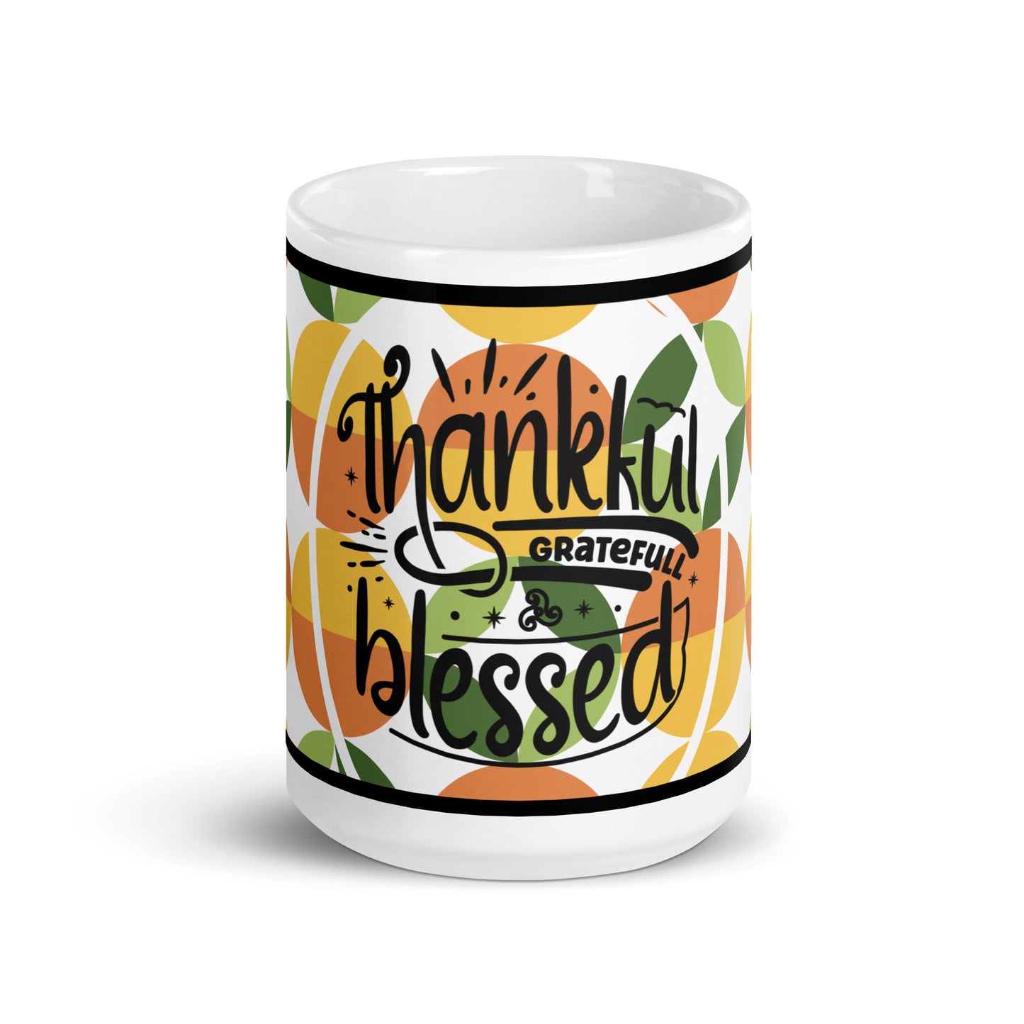 Front view of a white glossy mug with yellow, green, and orange abstract background and text saying 'thankful and blessed'