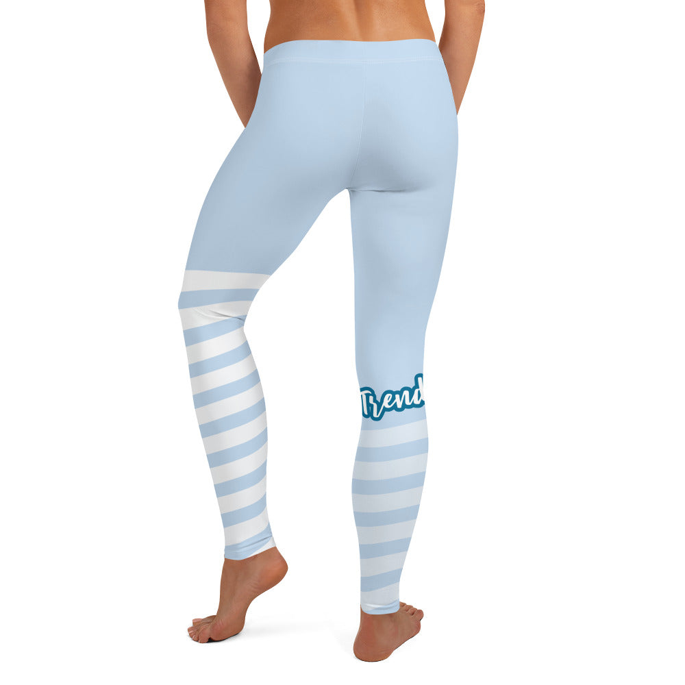 Back view of leggings with light blue on the top and light blue and white strips at the bottom, text saying "trendsetter' is across the right knew