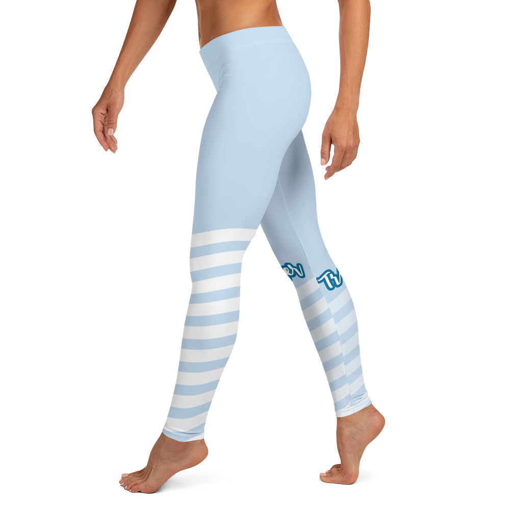 Left view of leggings with light blue on the top and light blue and white strips at the bottom, text saying "trendsetter' is across the right knew