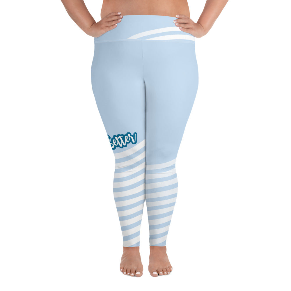 Front view of plus leggings with light blue on the top and light blue and white strips at the bottom, text saying "trendsetter' is across the right knee