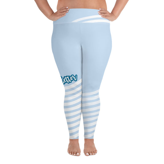 Front view of plus leggings with light blue on the top and light blue and white strips at the bottom, text saying "trendsetter' is across the right knee