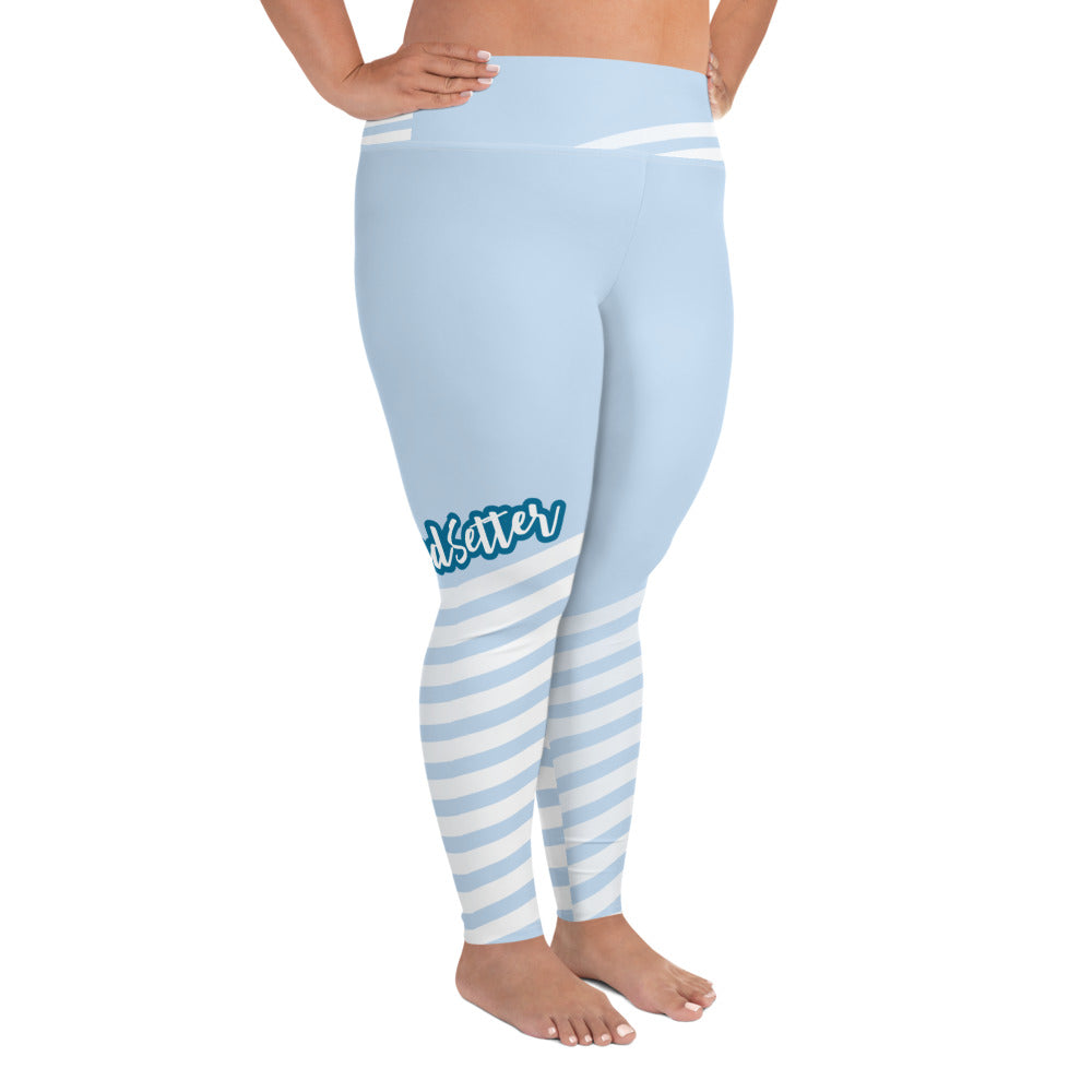 Right view of leggings with light blue on the top and light blue and white strips at the bottom, text saying "trendsetter' is across the right knee