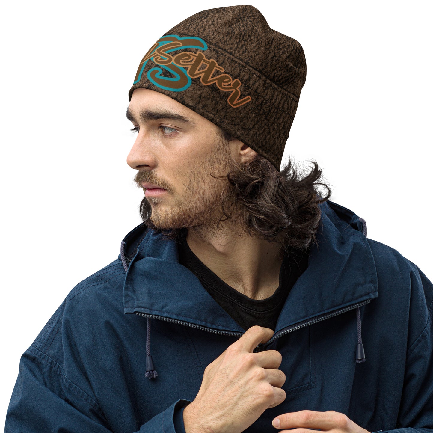 Left front of Brown Leather Print beanie with top teal text saying 'TS' and bottom bronze text saying 