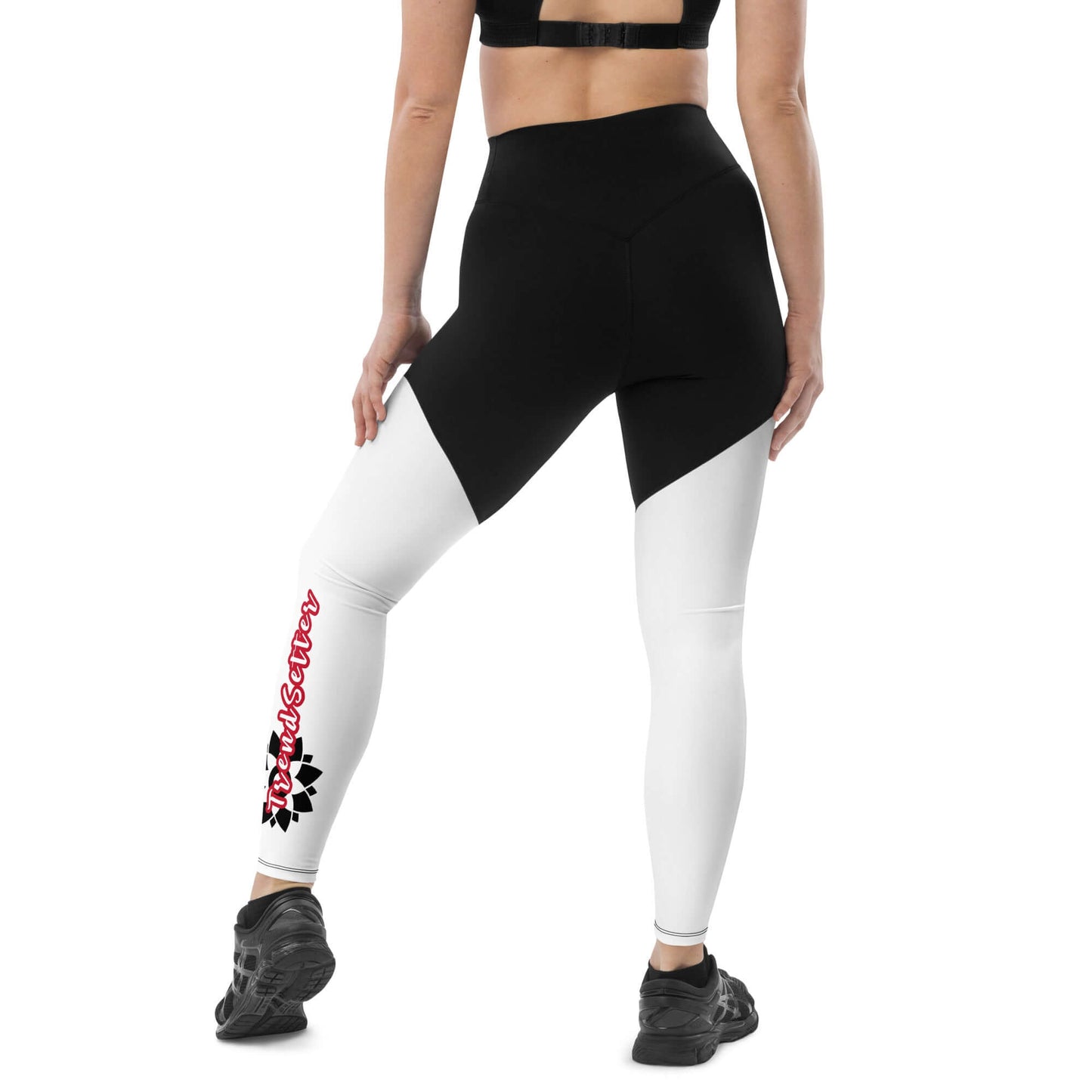 Back of black and white legging with vertical black and white design with text saying 'TrendSetter' on left calf