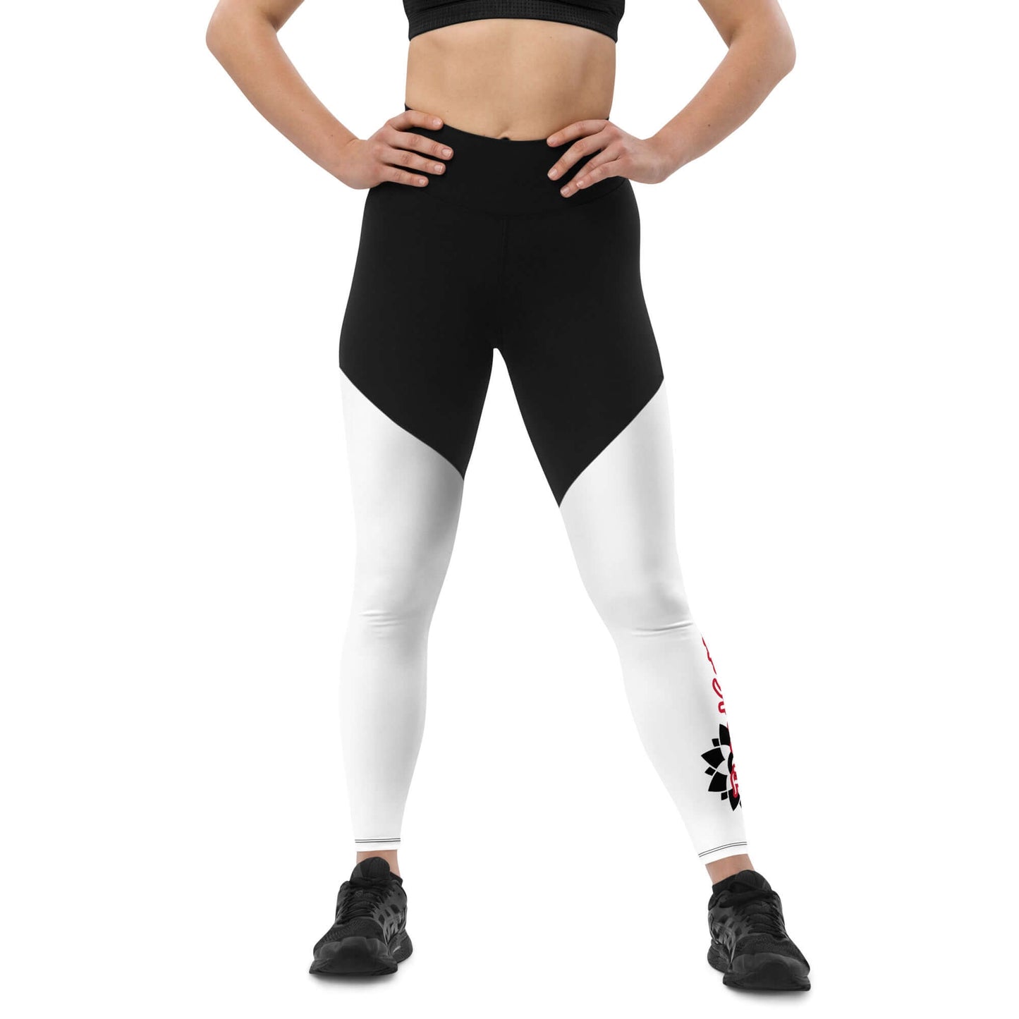 Front of black and white legging with vertical black and white design with text saying 'TrendSetter' on left calf