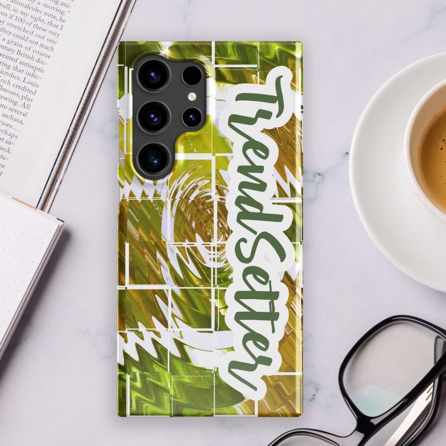 Front of TrendSetter mobile phone for Samsung with green and gold abstract pattern and text saying 'TrendSetter'