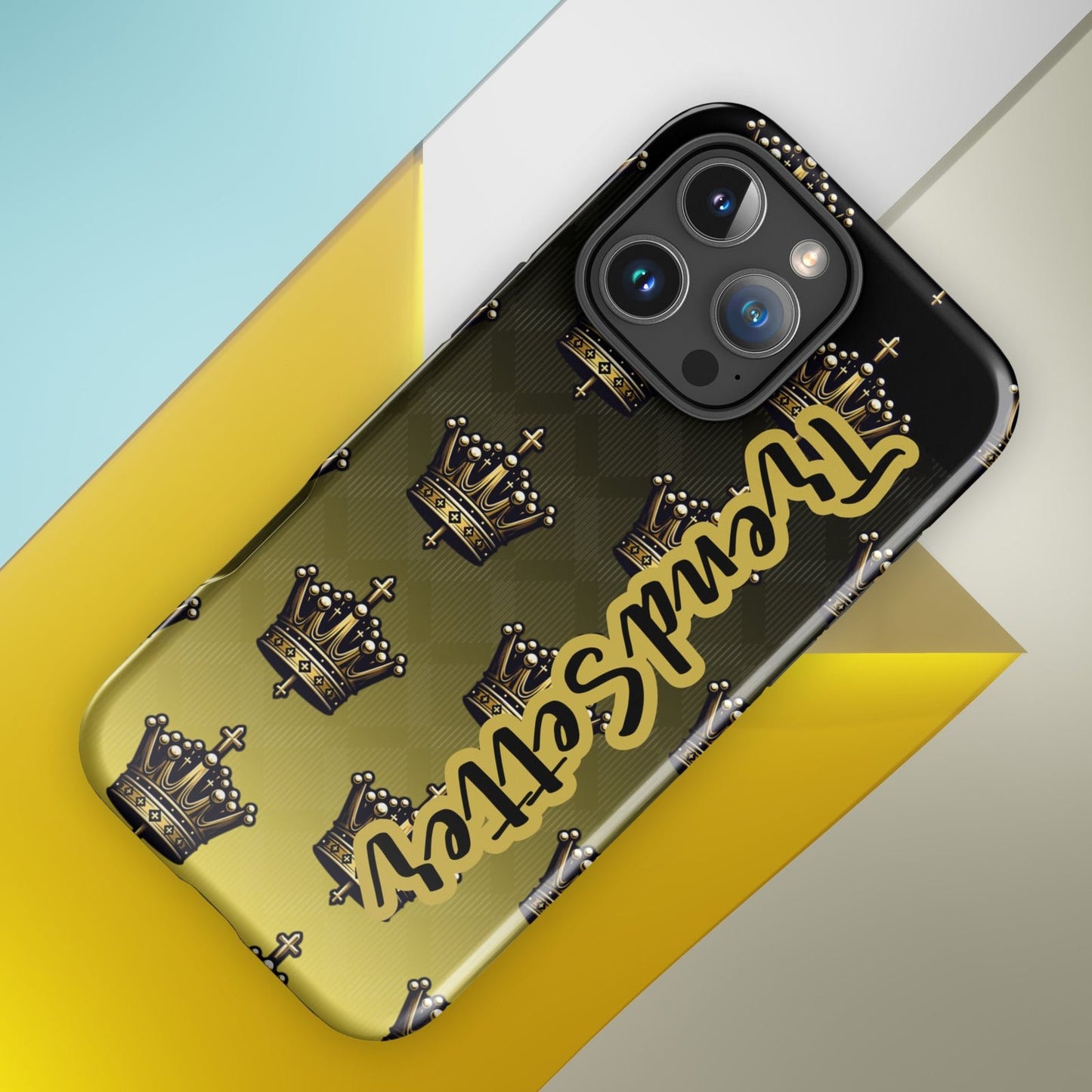 Front of 16 iPhone case with black and gold background with crowns and gold and black text saying 'TrendSetter'