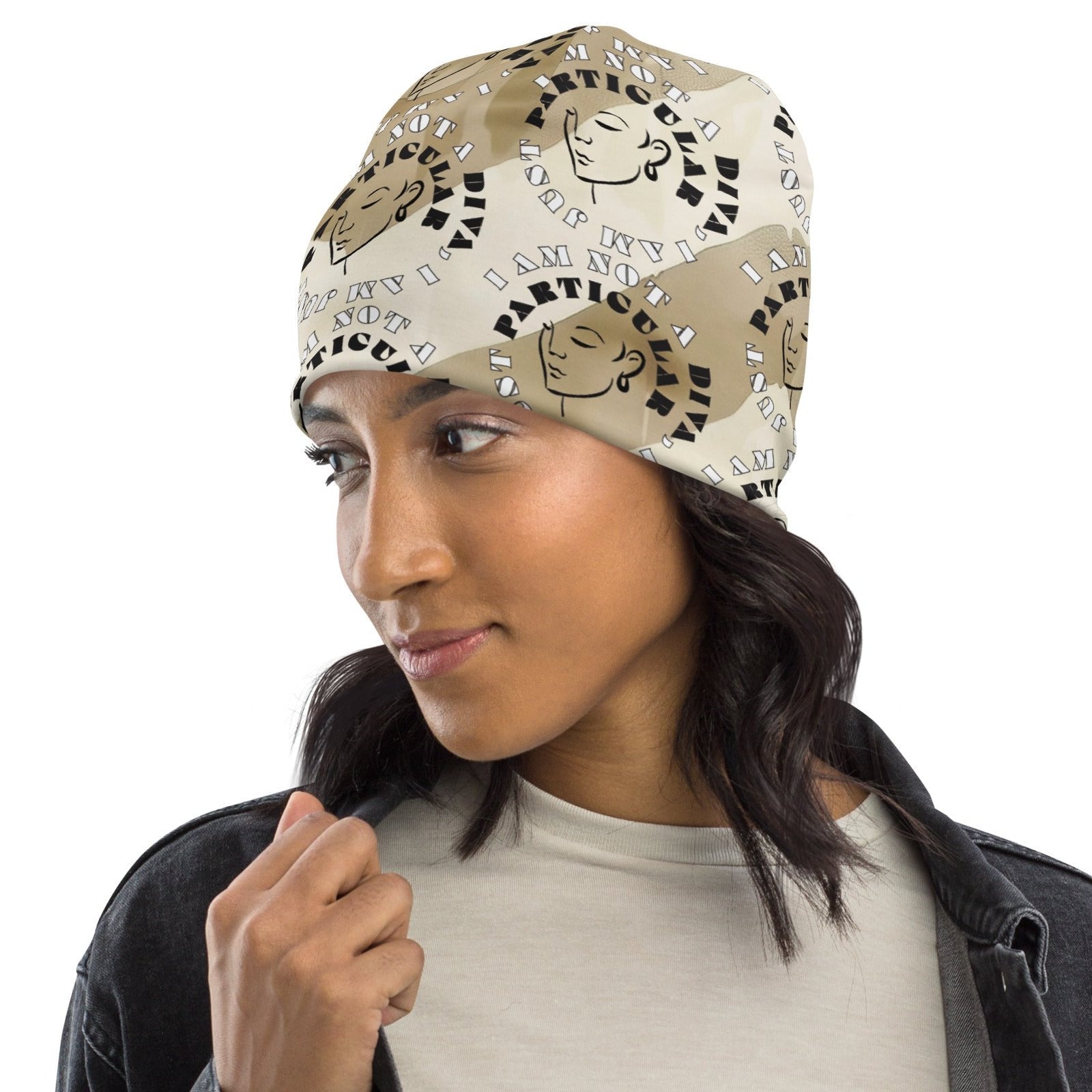 Left front of Beige and cream beanie with image of lady and text saying 'I am not a diva, I am just particular'