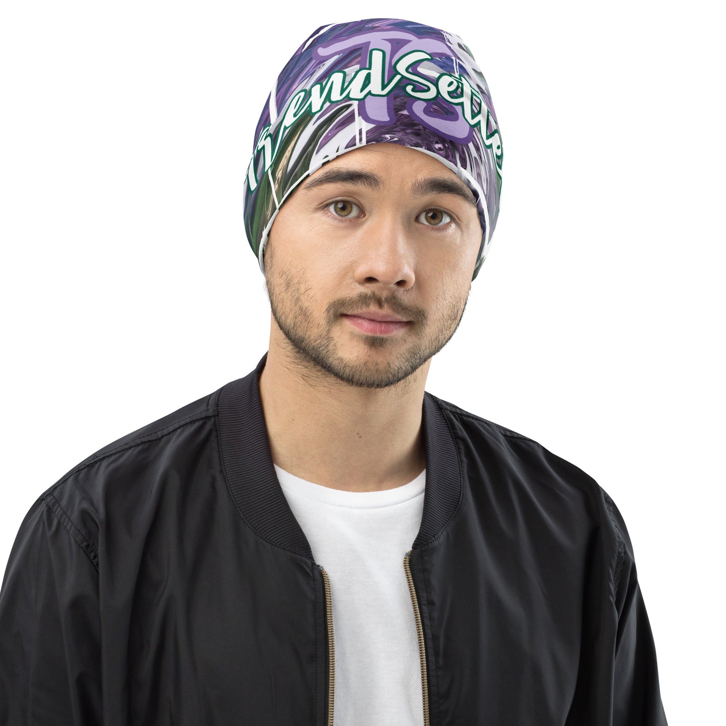 Front of purple and green print beanie with purple teal text saying 'TS' and bottom green text saying 'TrendSetter'