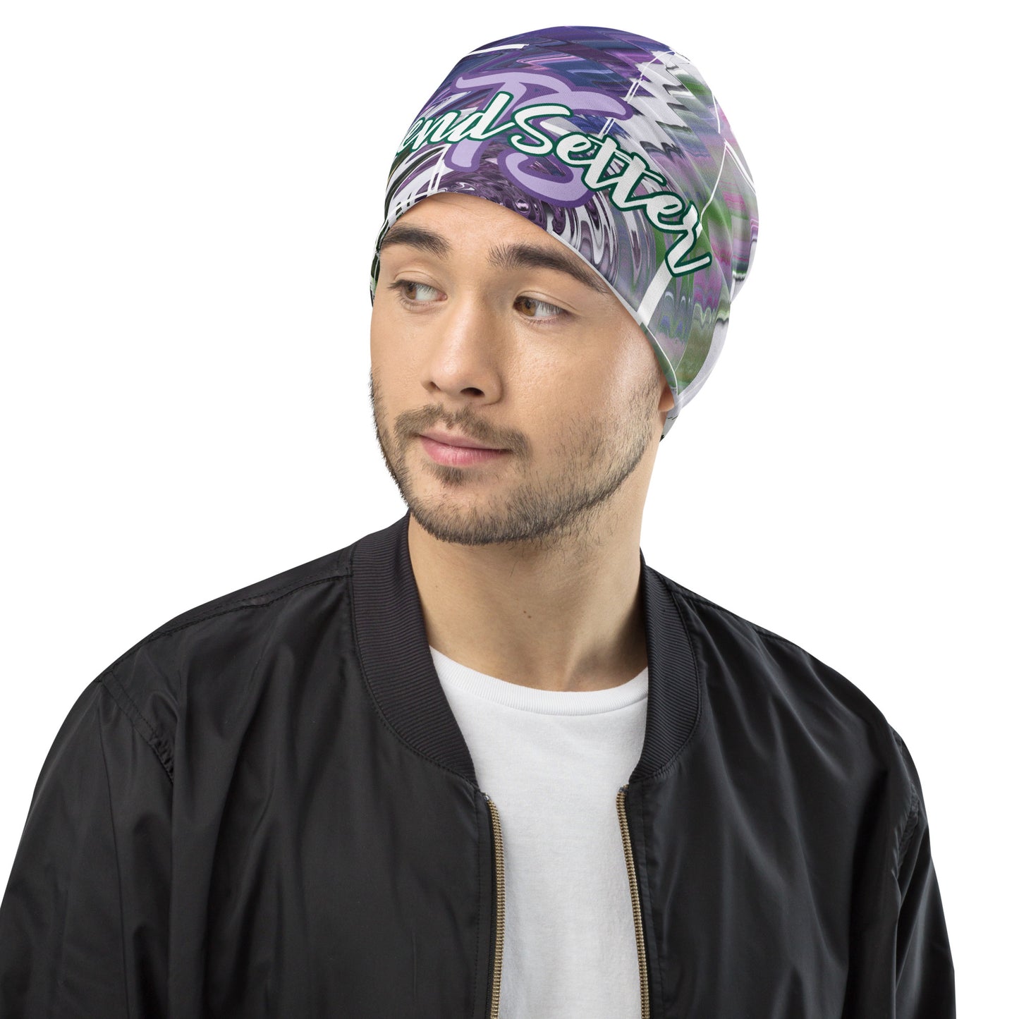 Left front of purple and green print beanie with purple teal text saying 'TS' and bottom green text saying 'TrendSetter'