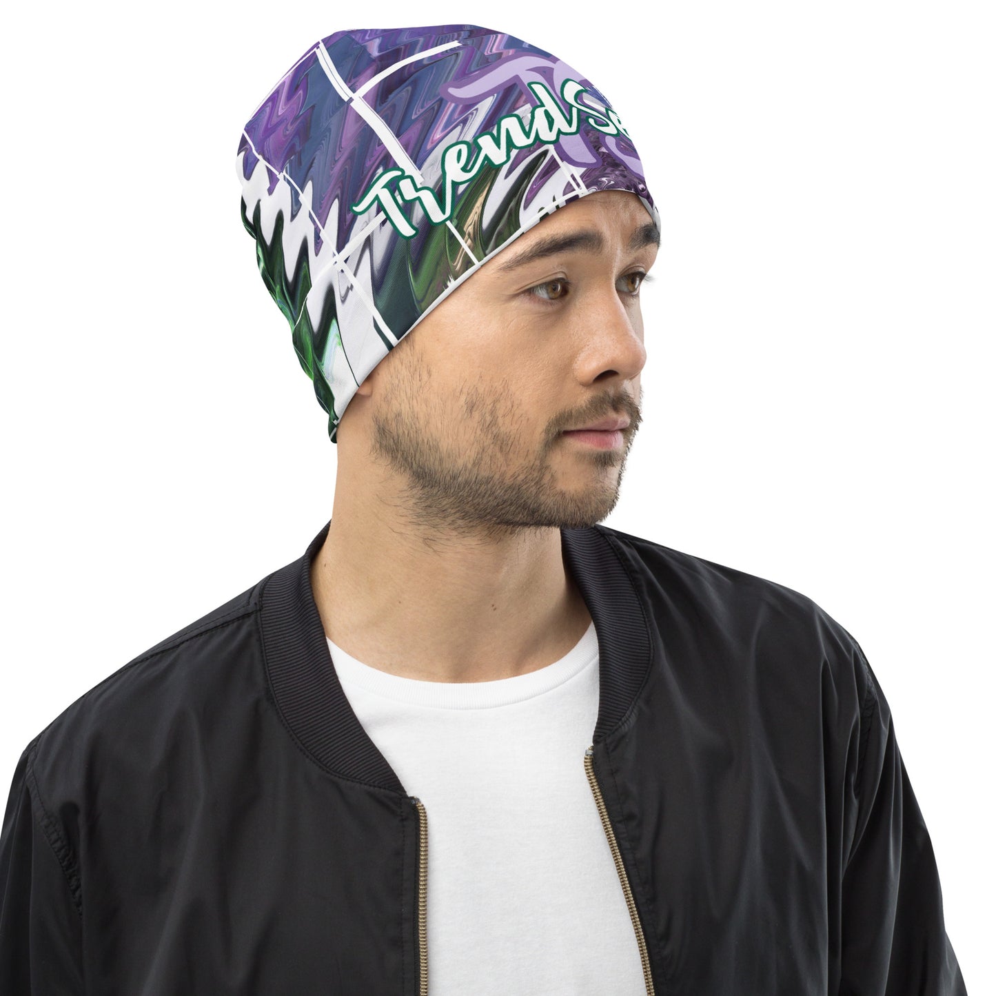 Right front of purple and green print beanie with purple teal text saying 'TS' and bottom green text saying 'TrendSetter'