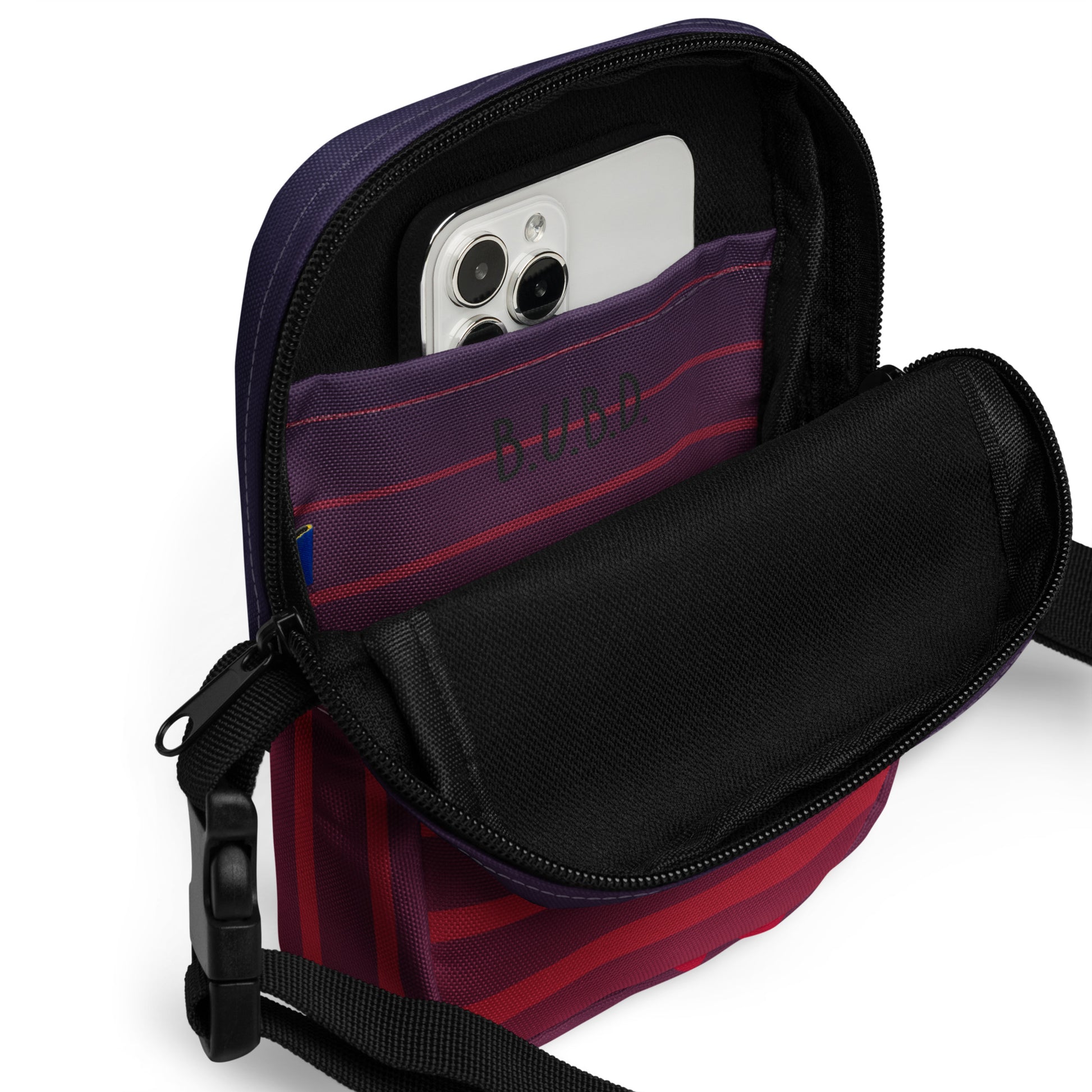 Inside of TrendSetter Utility Crossbody Bag with red and blue stripped design