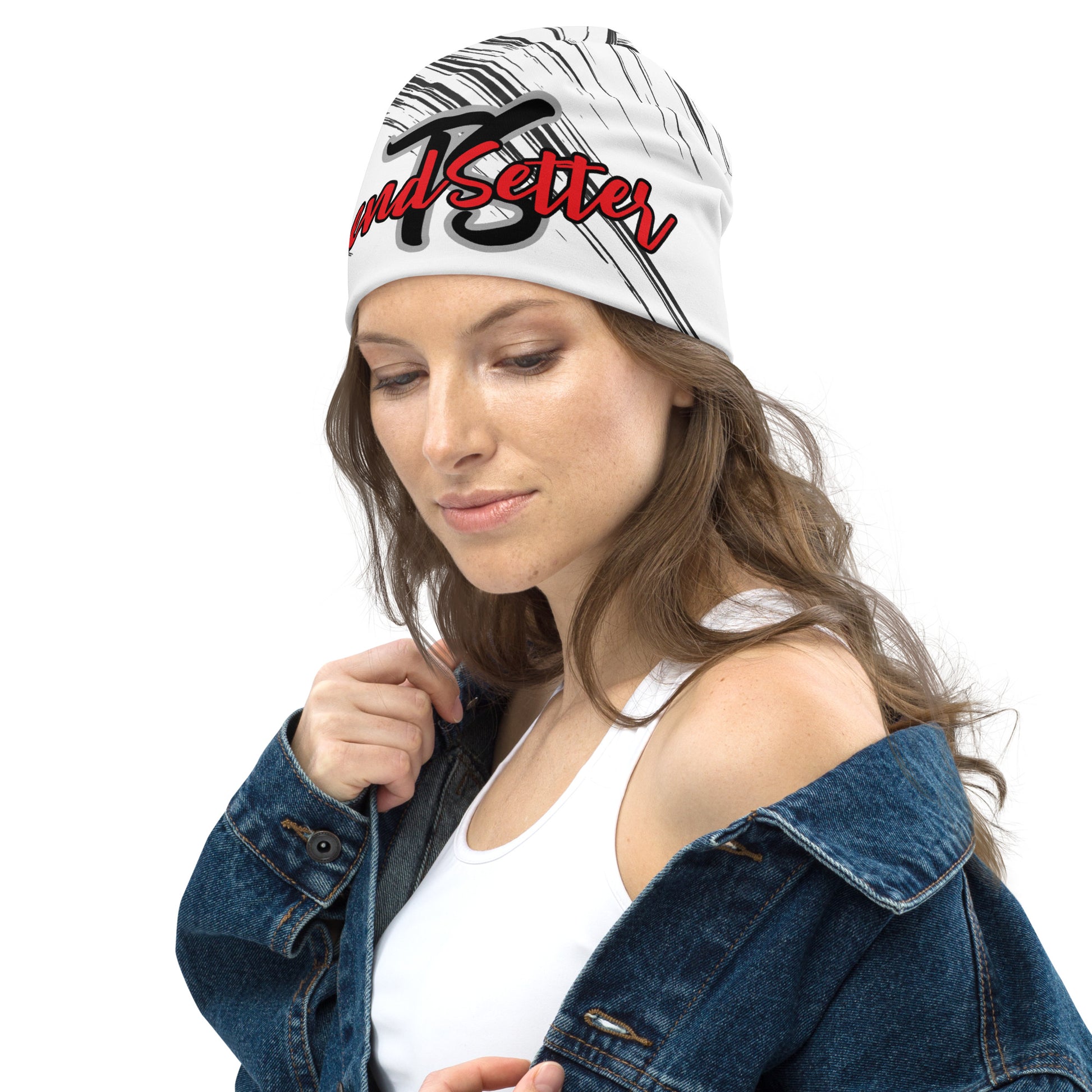 Left front of black and white beanie with black and gray text saying 'TS' and red and black text saying 