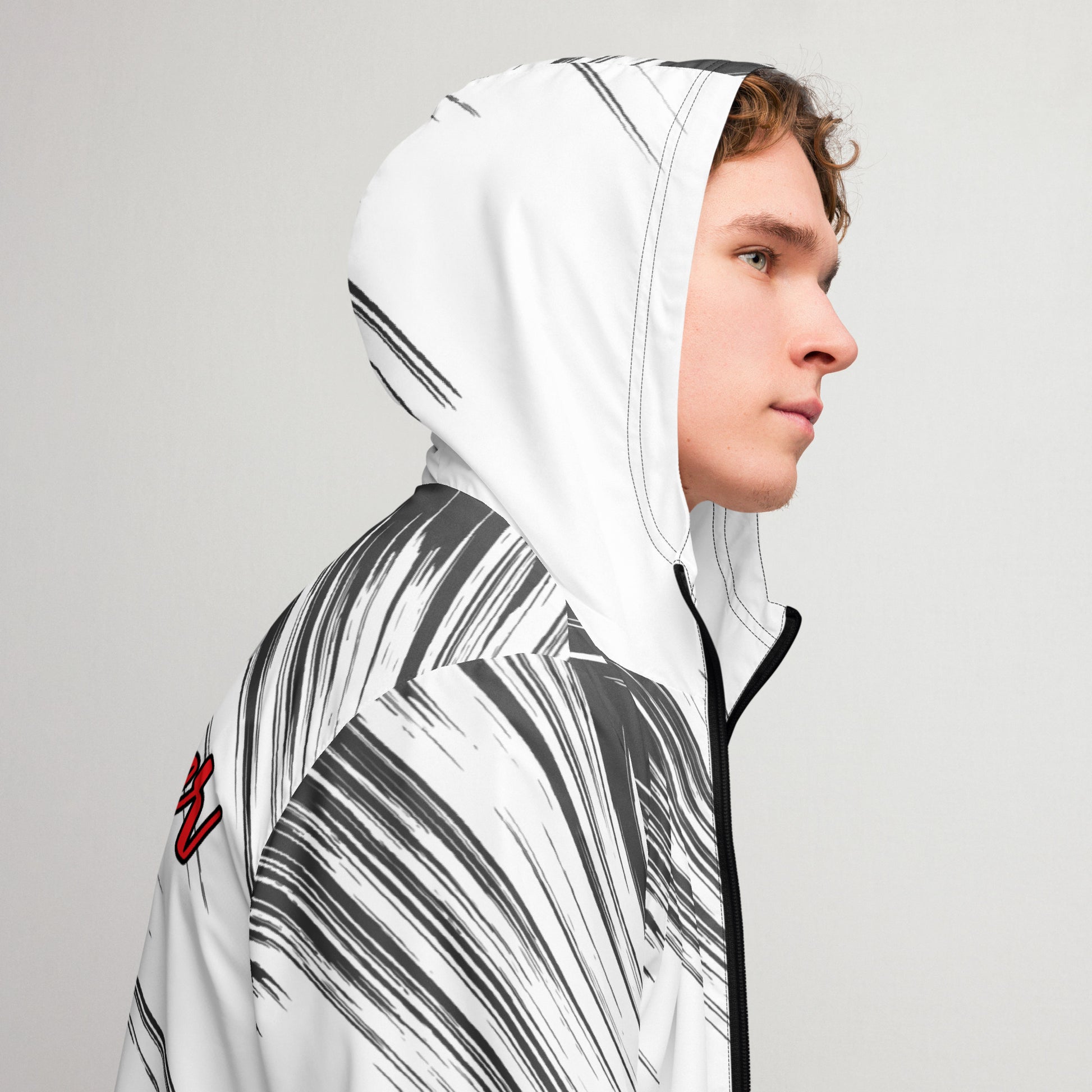 Right of a black and white windbreaker with hood emphasized