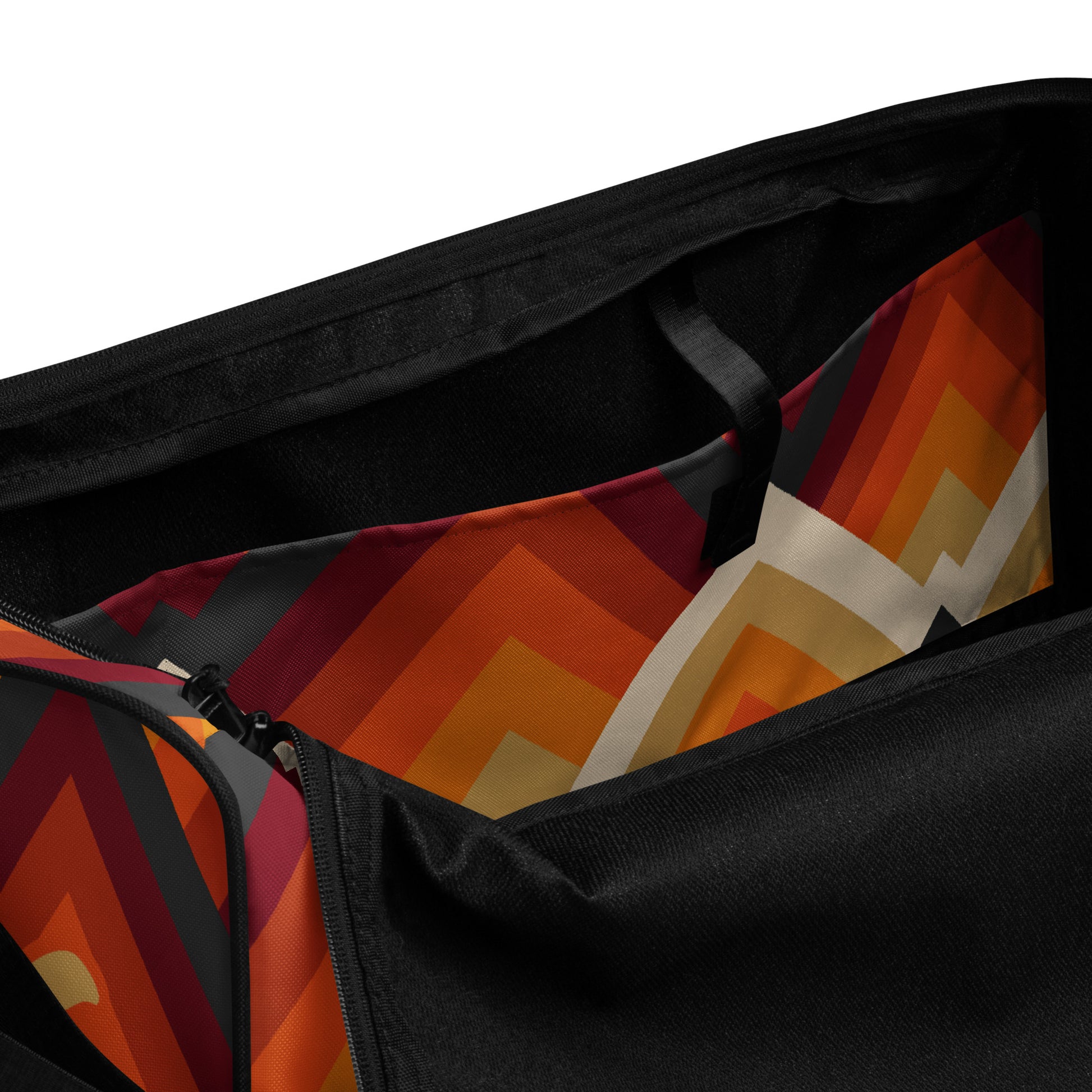 Inside pocket of orange tribal print duffel
