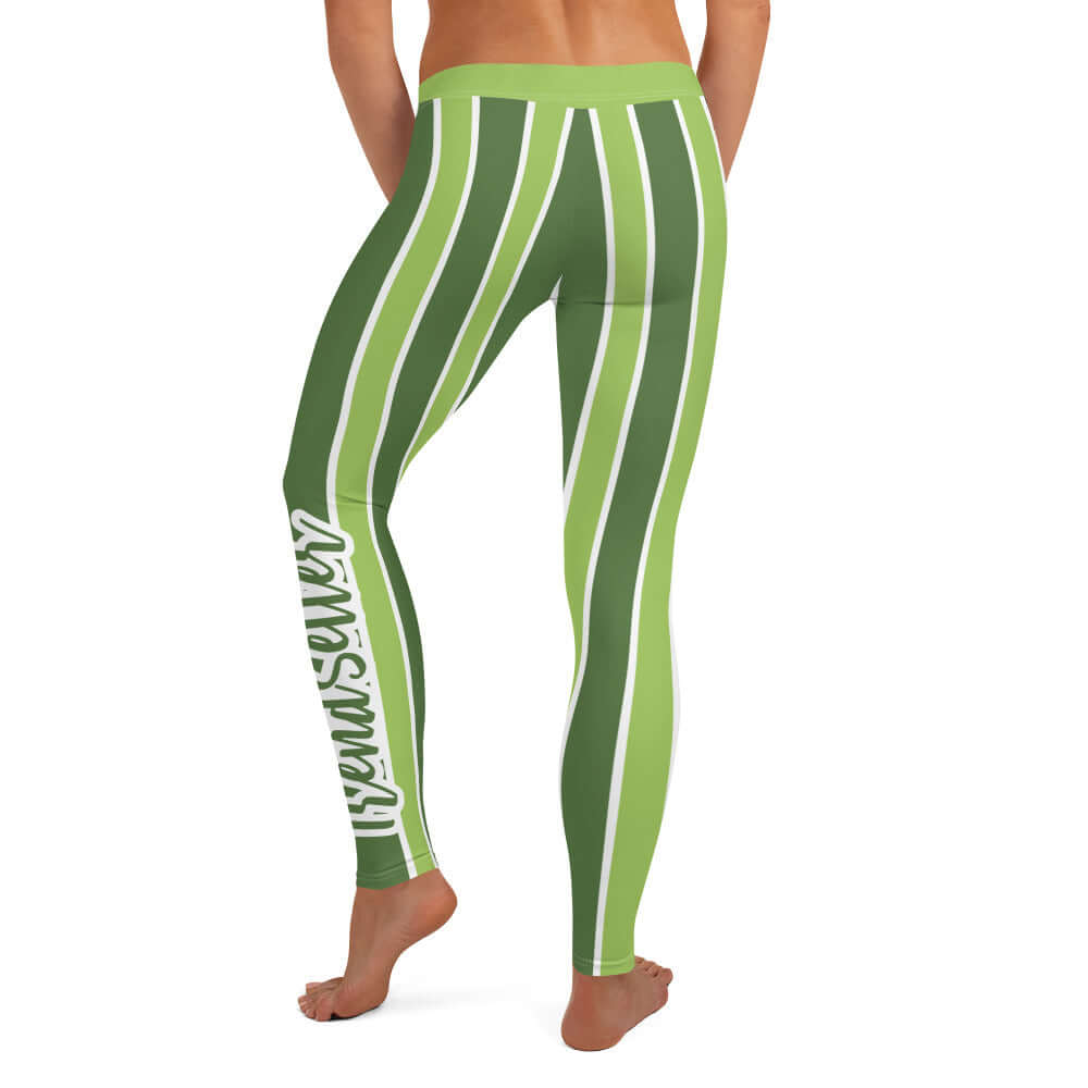 Back of green and white lined leggings with green and white text saying 'TrendSetter' on left calf