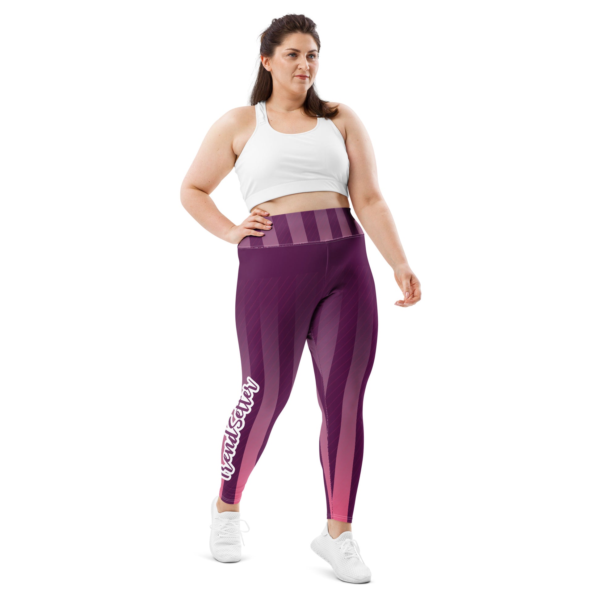 Front of purple and white lined leggings with purple and white text saying 'TrendSetter' on left calf