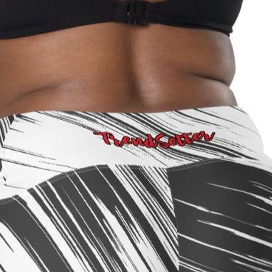 Back zoomed view of the TrendSetter leggings with black pattern and red 'TrendSetter' in red at back waist