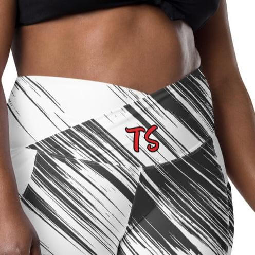 Front zoomed view of the TrendSetter leggings with black pattern and 'TS' in red at front waist