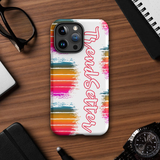 Front of iphone cover with white background with 3 color striped balls on left side and partial view of colored striped balls on right side. Text saying "Trendsetter" runs down from top to bottom.