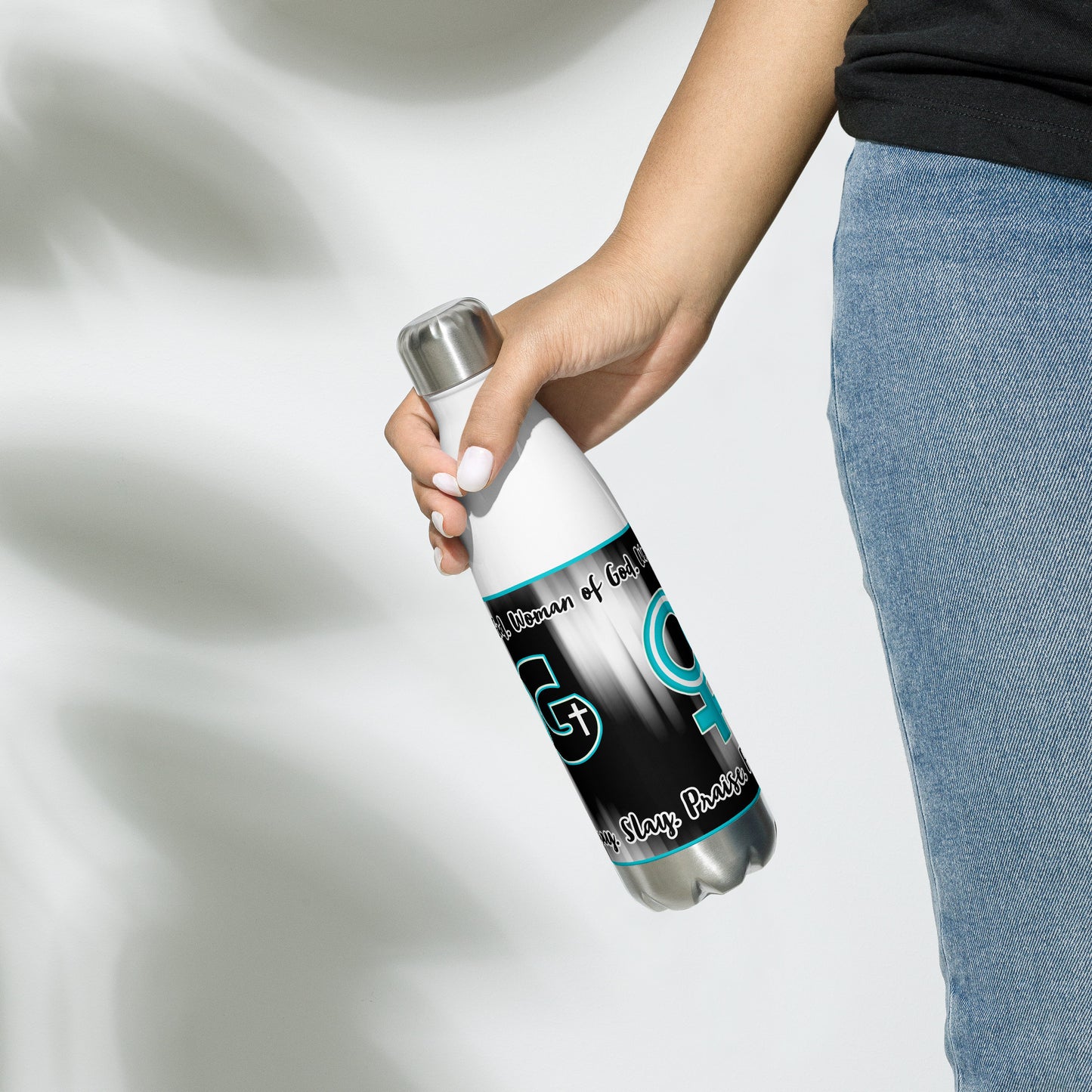 Right of white stainless steel water bottle with teal, black and white WOG logo on black and white background with black and white text at top and bottom being carried