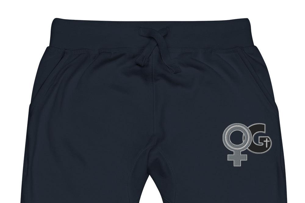 Front of navy sweatpants with embroidered symbol for woman of God on front, left thigh
