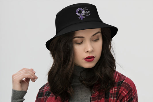 Front of black bucket hat with purple and black Woman of God image