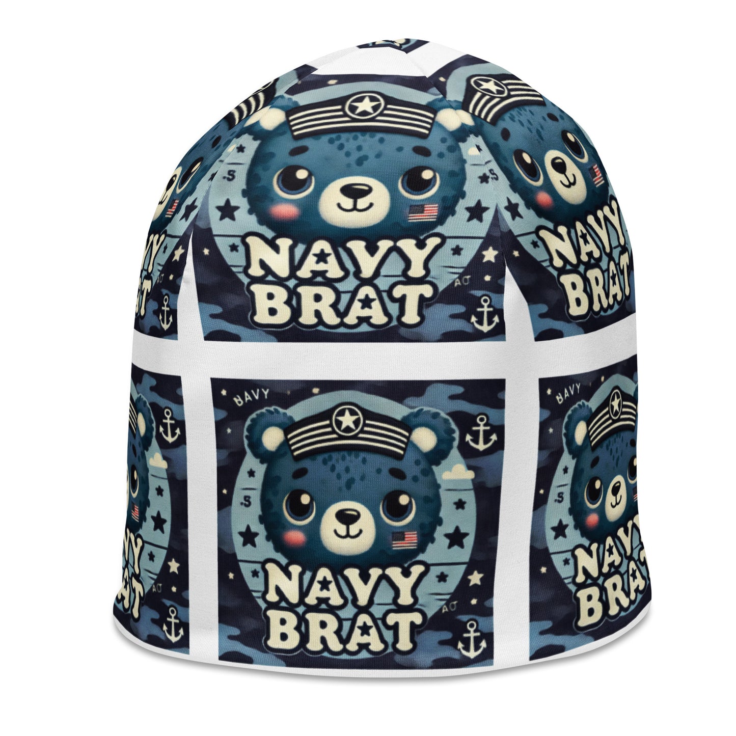Left front of youth beanie with blue baby bear and words saying 'navy brat' in blue pattern