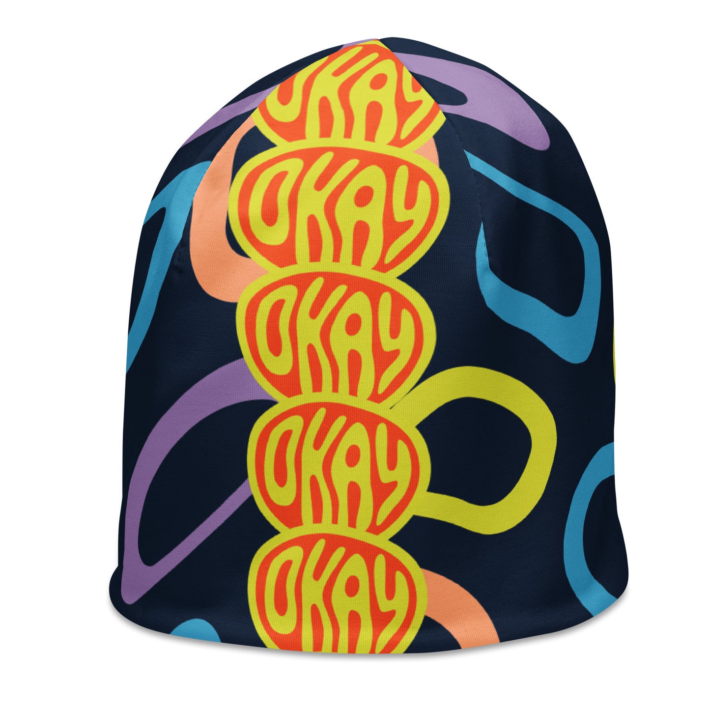 Left front of multi-colored and black print youth beanie with red and yellow icon saying 'okay'