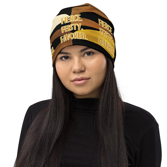 Head shot of woman wearing the Fierce. Feisty. Favored. black, brown, beige and gold print beanie, front view