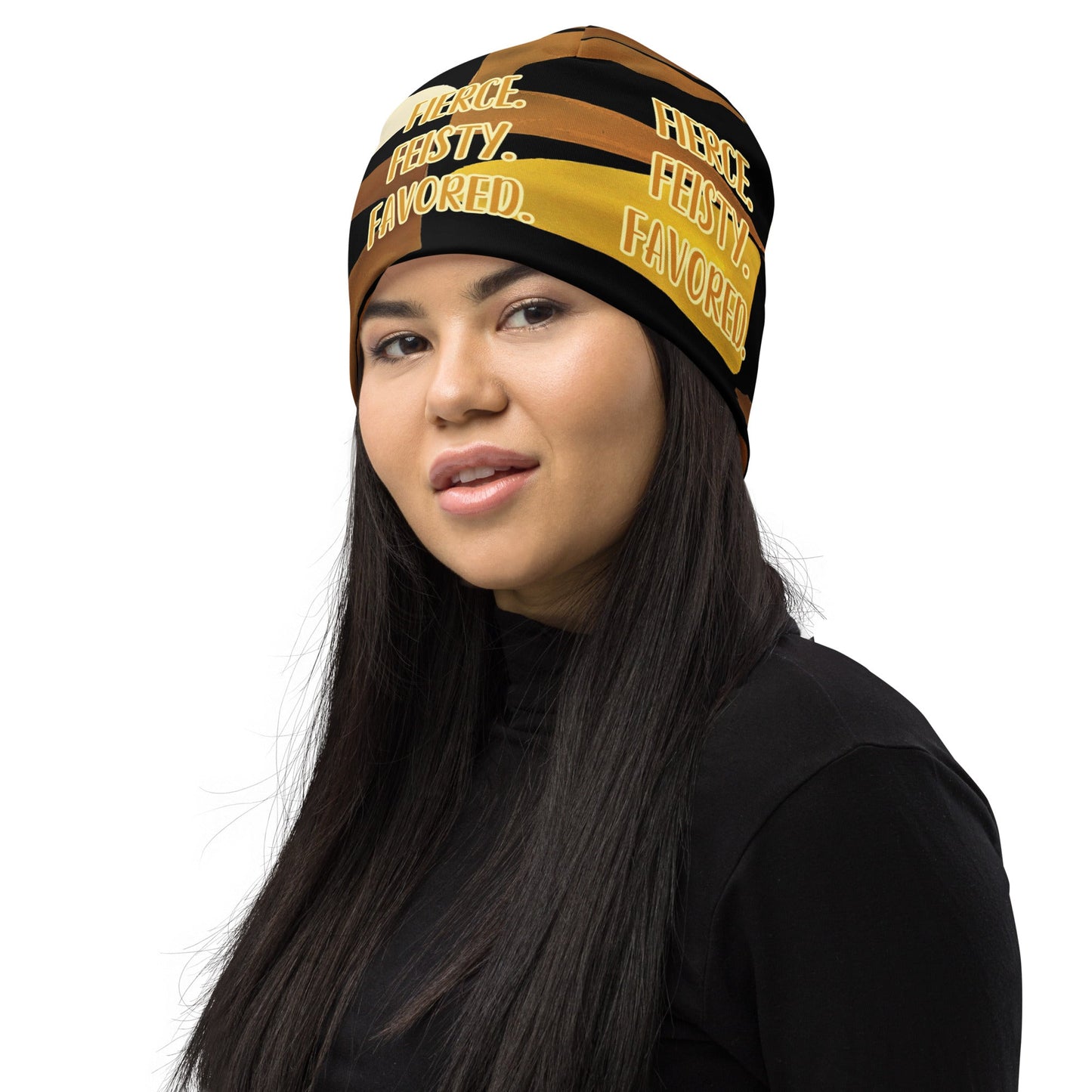 Product mockupHead shot of woman wearing the Fierce. Feisty. Favored. black, brown, beige and gold print beanie, front left-side view