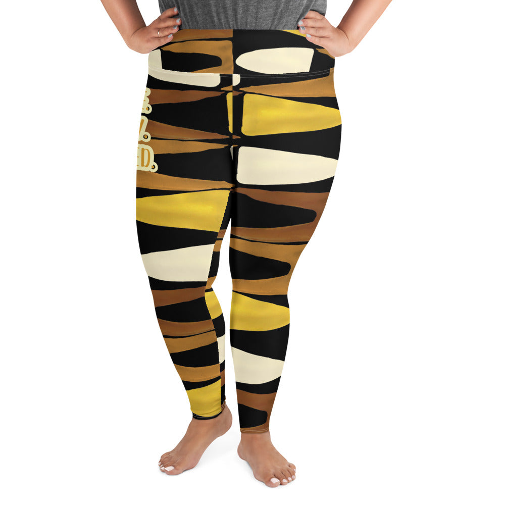 Half body front view of a woman wearing the Fierce. Feisty. Favored. black, brown, beige and gold print plus-size leggings