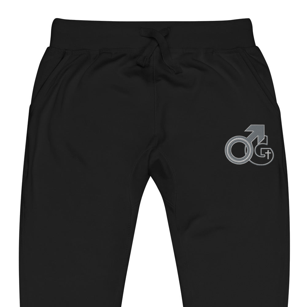 Man of God black sweatpants with black, white and gray logo on front, left thigh